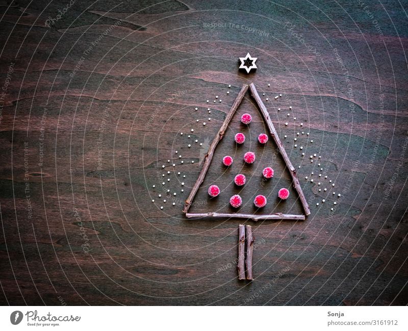 Christmas tree from wooden sticks and red balls Lifestyle Christmas & Advent Stars Sign Idea Creativity consecrate sb./sth. Tree flat lay Wooden table Brown