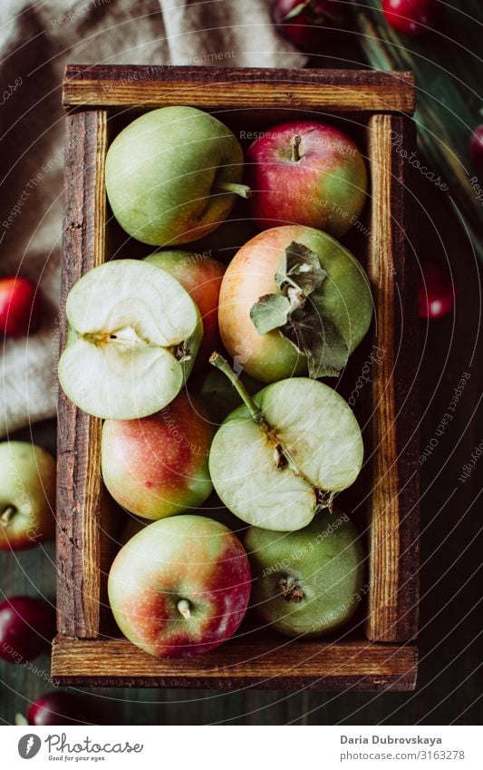 Ripe garden apples in a wooden crate sweet fresh autumn juicy healthy background food delicious nature natural harvest table organic diet season ripe farm top