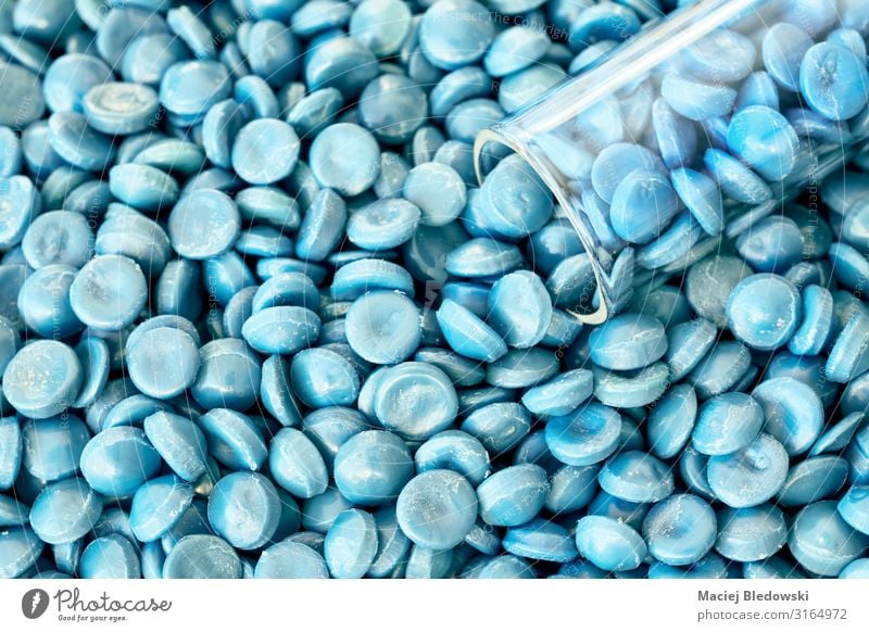 Close up of high-density polyethylene (HDPE) granules. Laboratory Factory Industry Plastic Blue polymer alkathene thermoplastic Pellet compound Close-up
