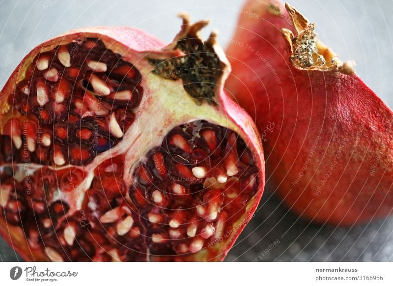 pomegranate Food Fruit Pomegranate Exotic Fresh Healthy Delicious Near Natural Orange Red Sliced Division Kernels & Pits & Stones Colour photo Interior shot