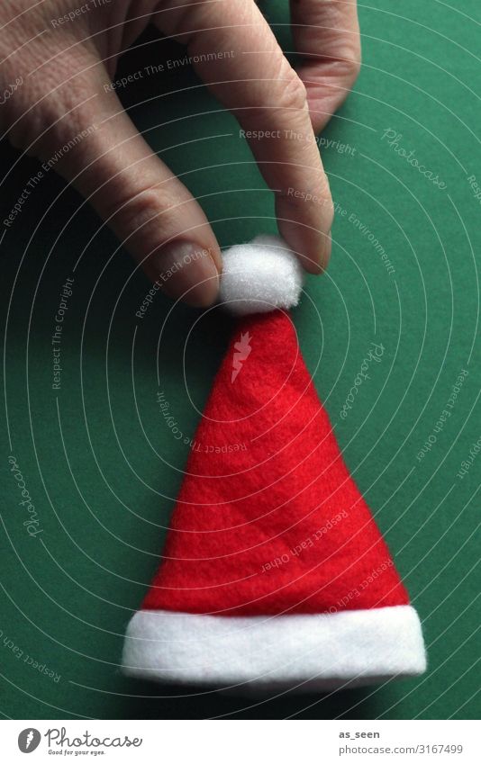 Decorate cap Feasts & Celebrations Christmas & Advent Hand Fingers Cap Santa Claus hat Touch To hold on Esthetic Cool (slang) Happiness Uniqueness Modern