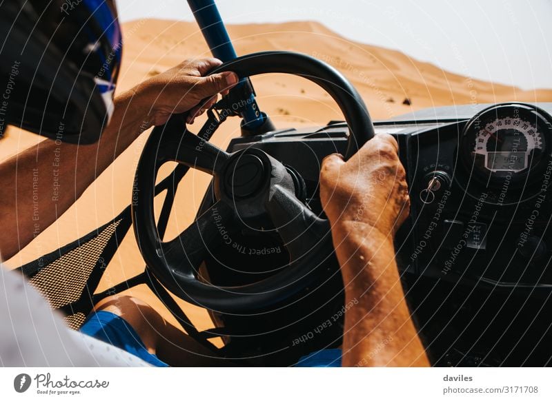 Man driving an off road buggy in Shara desert. Vacation & Travel Trip Adventure Expedition Sports Engines Adults Hand 1 Human being Nature Sand Desert Transport