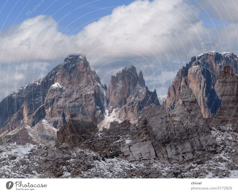 Dolomites Environment Nature Landscape Air Sky Clouds Bad weather Ice Frost Snow Rock Alps Mountain Peak Gigantic Wild Blue Gray White Moody Colour photo