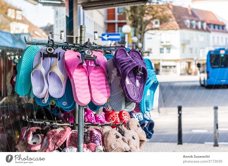 Colorful bathing shoes on a stand in front of a cheap department store Wellness Swimming & Bathing Vacation & Travel Summer Summer vacation Beach Ocean