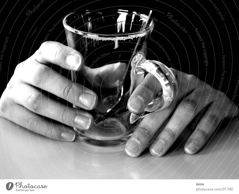 Hands out of the darkness Cup Contrast Still Life Calm Light Nerviness Empty Fragile Spoon Thin Fingernail Dark Indefinite Ambiguous Table England Break Touch