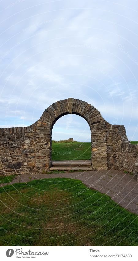 wall arch Grass Ruin Gate Architecture Wall (barrier) Wall (building) Old Historic Blue Brown Green Curiosity Vacation & Travel Past wall passage Passage