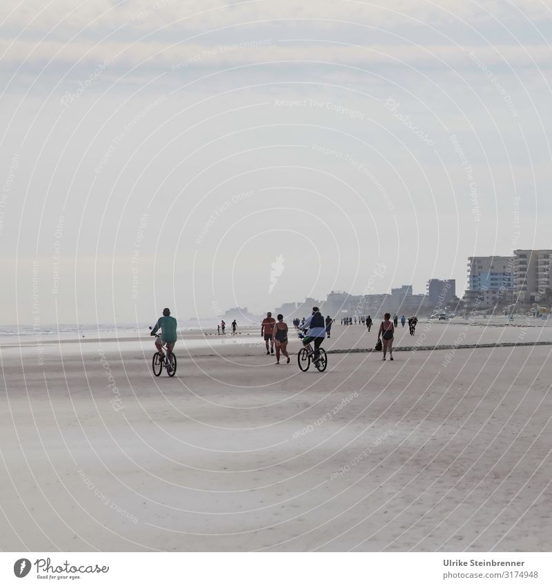 Pedestrians and cyclists on the beach of Daytona Beach, Florida Joy Leisure and hobbies Vacation & Travel City trip Fitness Sports Training Cycling Human being