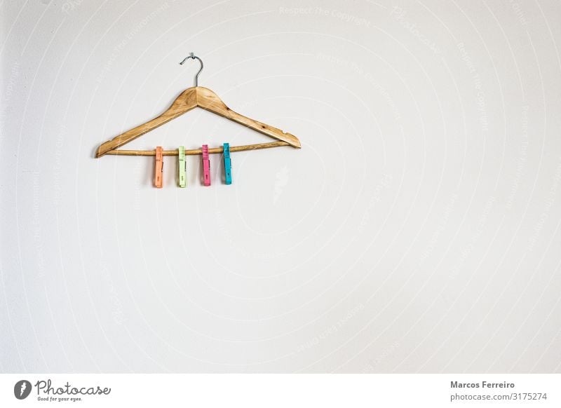 hanger with colorful clothespins on white wall Lifestyle House (Residential Structure) Clothing Plastic Hang Green Pink Red Colour tops changing Home Selection