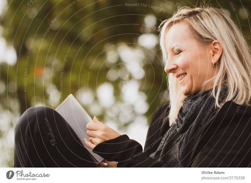 outdoor reader Reading Human being Feminine Woman Adults 1 45 - 60 years Blonde Long-haired Book Laughter Happiness Moody Caution Serene Calm Diligent Education