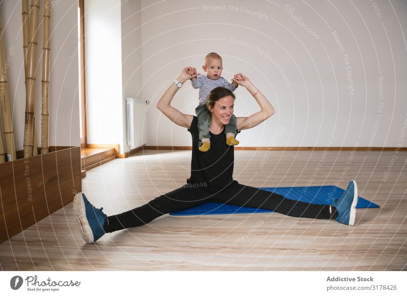 Mother exercising with baby in gym Baby Gymnasium Practice workout Story abs Fitness Modern Lifestyle Woman Child Happy Smiling Cheerful Joy Sportswear