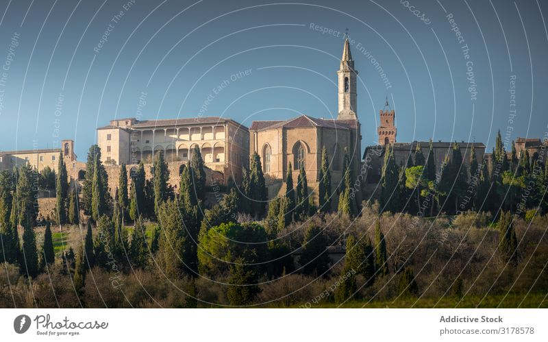 Aged cathedral in green rural land Cathedral Landscape Picturesque Italy Tuscany Panorama (Format) Ancient Vacation & Travel Tourism Destination Village