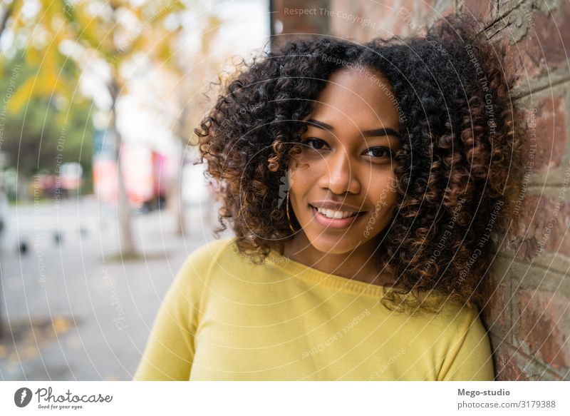 Portrait of Afro-american woman in the street. Beautiful Hair and hairstyles Relaxation Calm Camera Human being Woman Adults Street Brunette Smiling Stand