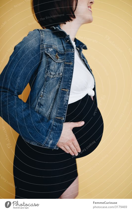 Urban young pregnant woman - neutral background Feminine Woman Adults 1 Human being 18 - 30 years Youth (Young adults) 30 - 45 years Happy Joy Anticipation