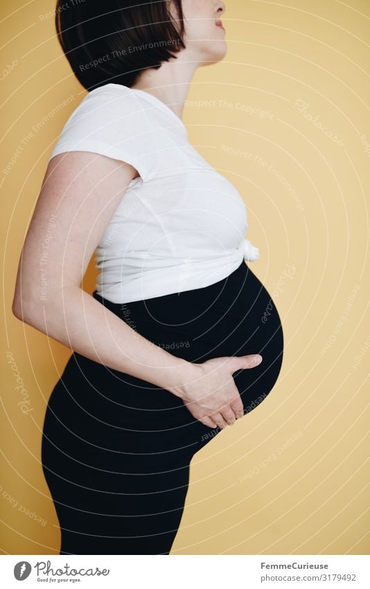 Urban young pregnant woman - neutral background Feminine Woman Adults 1 Human being 18 - 30 years Youth (Young adults) 30 - 45 years Happy Baby bump