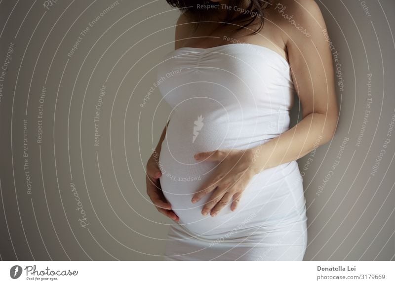 Pregnant young woman details belly in white dress Human being Feminine Young woman Youth (Young adults) Woman Adults Hand 1 30 - 45 years Clothing White Love