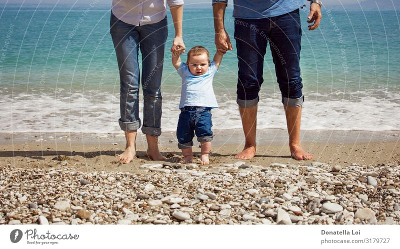 Family on the beach Lifestyle Happy Leisure and hobbies Summer Ocean Human being Masculine Feminine Toddler Parents Adults Mother Father Family & Relations