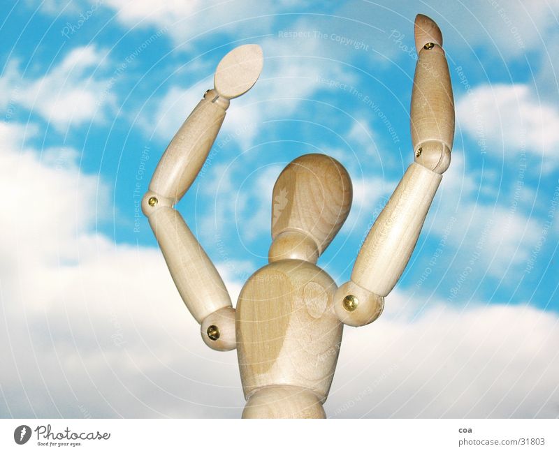 The articulated puppet is happy Manikin Clouds White Brown Wood Obscure Sky Blue Joy Arm