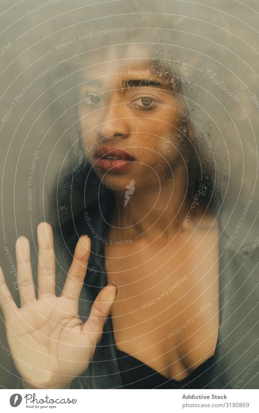Black woman behind wet glass Woman Portrait photograph Window Wet Looking into the camera Passion Home African-American Youth (Young adults) Alluring