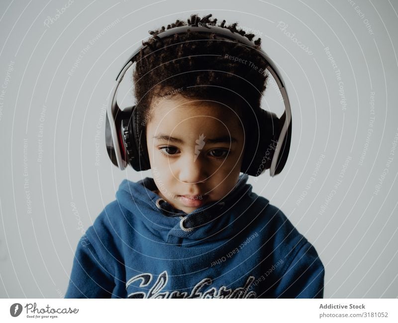 Black child listening to music Boy (child) Listening Music Headphones Hip & trendy Easygoing African-American Lifestyle Leisure and hobbies sweatshirt