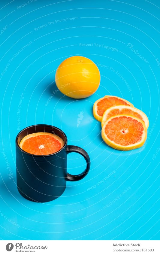 Mug with fresh citrus Breakfast Conceptual design Drinking Slice Morning Juicy Cut Grapefruit Orange Piece Fresh Raw Mature Vegan diet Energy Healthy Fruit