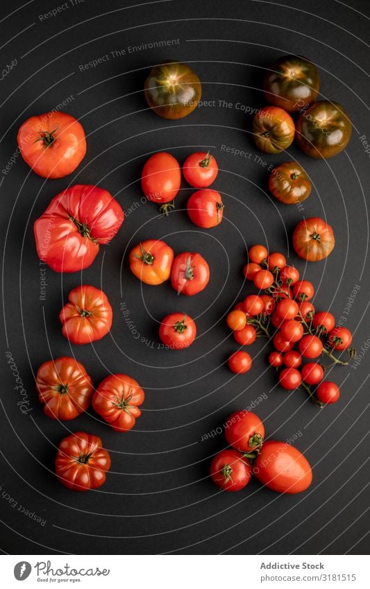 from above view of tomatoes on a black surface Background picture Plant Vegetable Deserted Fresh Juicy Agriculture Fruit Food Healthy Black Tomato
