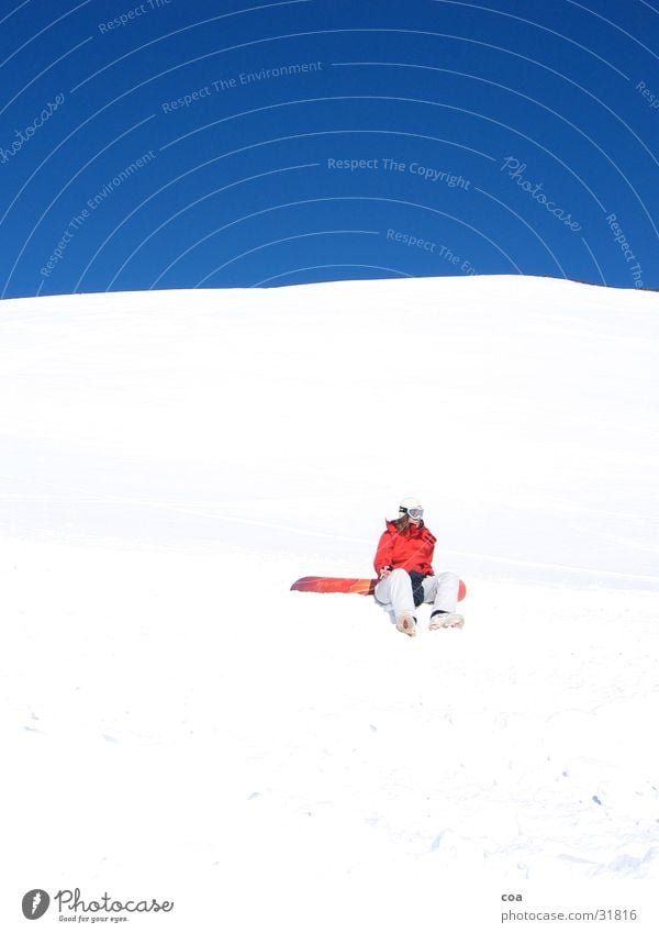 rest Winter White Red Snowboard Break Calm Crouch Sports Blue Sky Sit Snowboarder Cloudless sky Bright Colours Beautiful weather 1 Winter mood Ski run Flashy