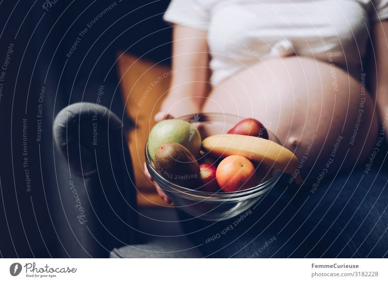 Nutrition during pregnancy - pregnant woman with fruit bowl Feminine Woman Adults 1 Human being 18 - 30 years Youth (Young adults) 30 - 45 years To enjoy