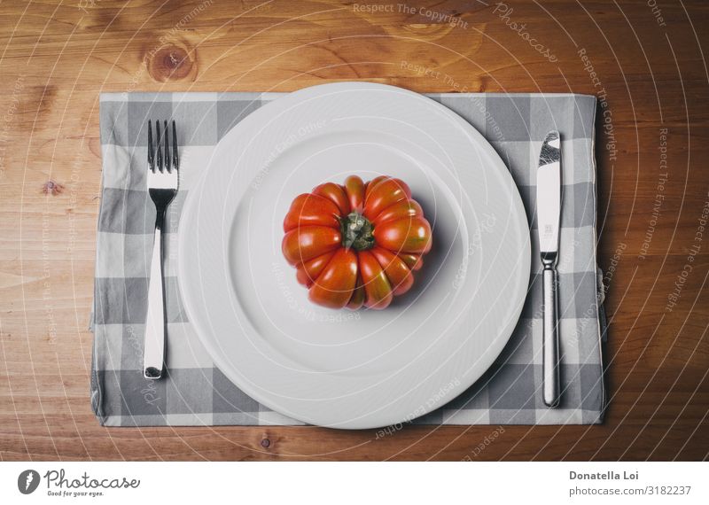 Red tomato on white plat Vegetable Nutrition Eating Lunch Dinner Diet Plate Fork Table Kitchen Nature Wood Feeding Authentic Good White Italy dietary knife one
