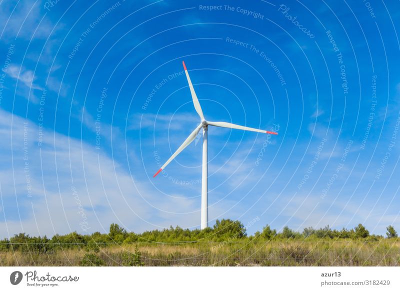 Rotating windmill generating renewable energy wind power at land Economy Energy industry Business Success Technology Science & Research Advancement Future