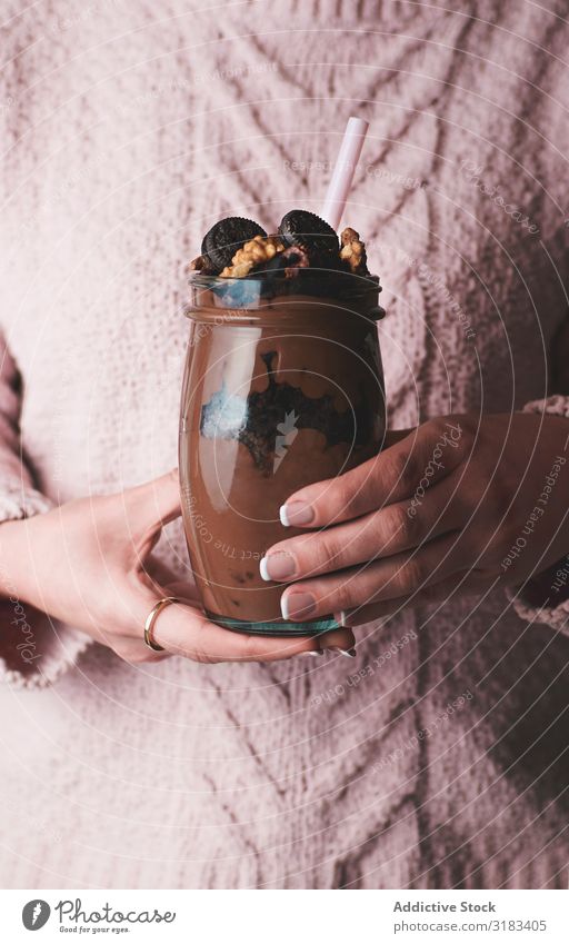 Crop woman with jar of chocolate mousse Woman Chocolate Dessert Milkshake Glass Delicious Food Drinking Cold Mousse Fresh Sweet Nutrition Beverage Sweater Pink