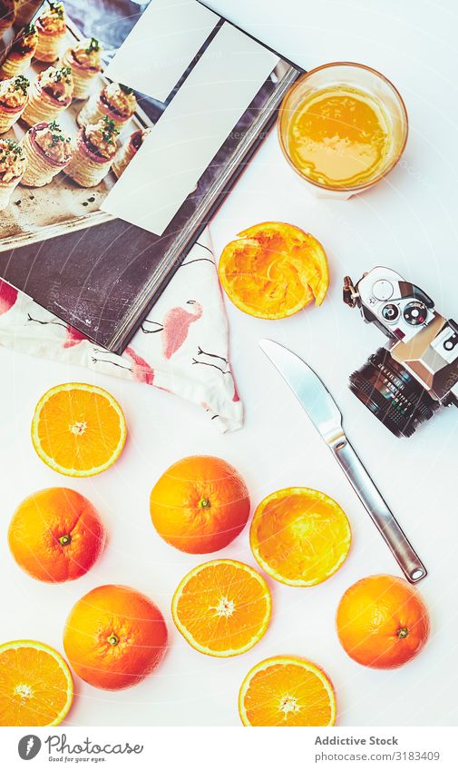 Arrangement of oranges and photo camera composition Orange Cooking Book Vintage Conceptual design Juice Kitchen Fresh Ingredients squeeze Food Meal Home-made