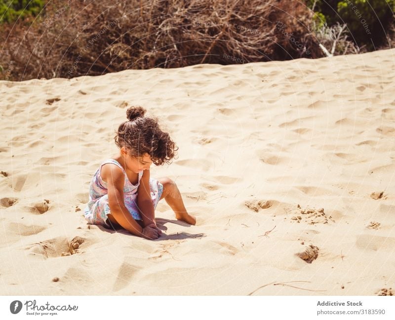 Cute little girl playing with sand at beach Girl Walking Beach Sand Child Small Playing Summer Vacation & Travel Ocean Youth (Young adults) Exterior shot