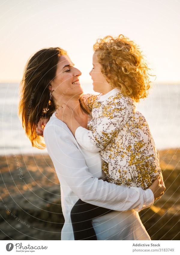 Mother with her daughter at beach Family & Relations Beach seaside Vacation & Travel Child Smiling Embrace Woman Middle-aged Daughter Girl Together Ocean Summer