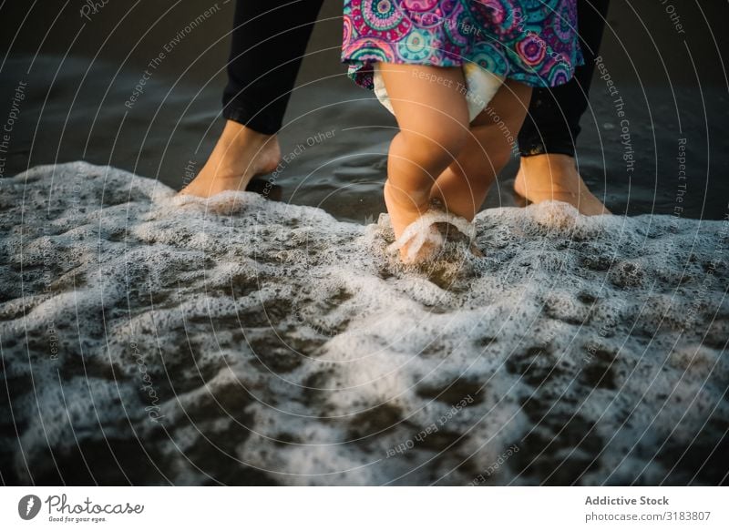 Mother holding walking child Woman Son Beach seaside Sand Observe Vacation & Travel Ocean Summer Water Stand Together oceanside Coast Nature Landscape Tropical