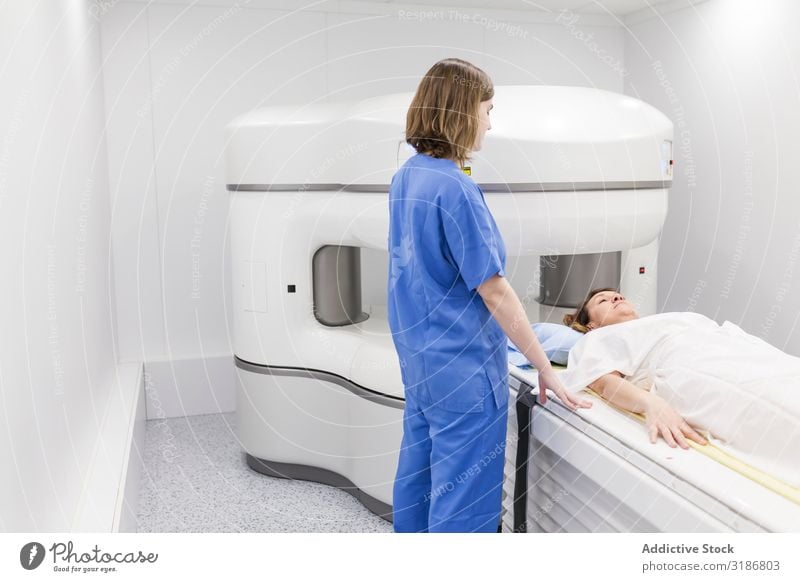 open magnetic resonance machine exam Patient undergoing Woman Youth (Young adults) Human being radiologist Radiology Doctor oncology Magnetic Hospital