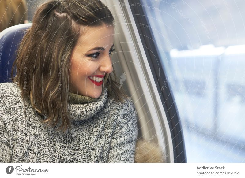 young woman looking through window in train Railroad Window Cheerful Woman Happy looking out Youth (Young adults) Girl Passenger Vacation & Travel Transport
