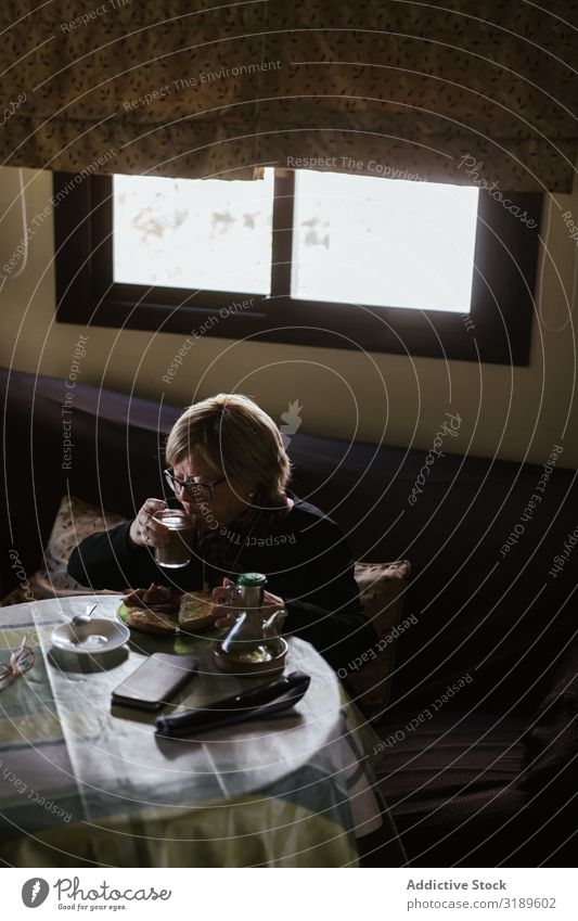 Senior woman drinking coffee at breakfast Woman Drinking Coffee Senior citizen Breakfast Human being Lifestyle Attractive Home Beverage Aromatic Sit Morning Old