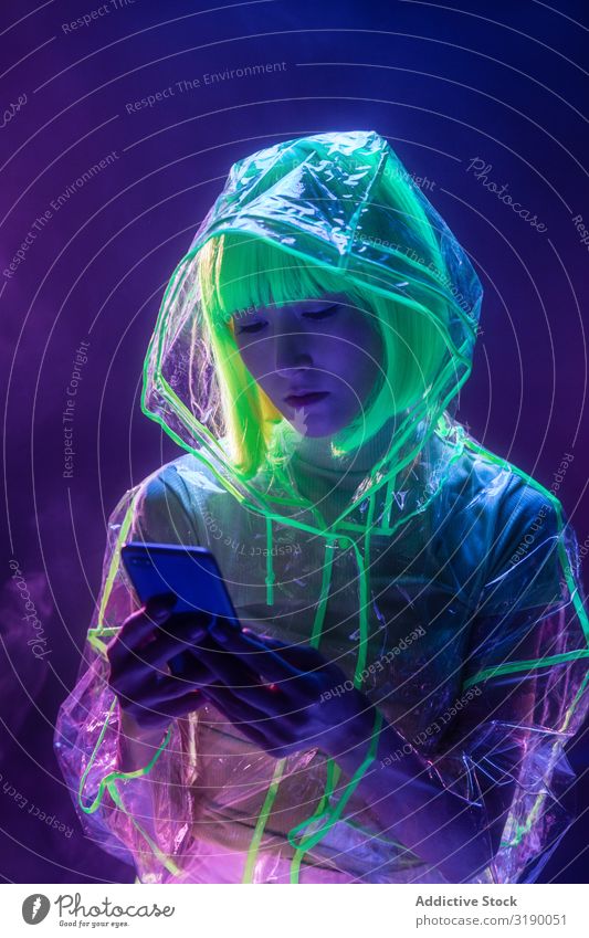 Asian young woman using phone Woman PDA Future asian Youth (Young adults) Mobile Conceptual design Fluorescent Telephone pretty Human being Technology Light