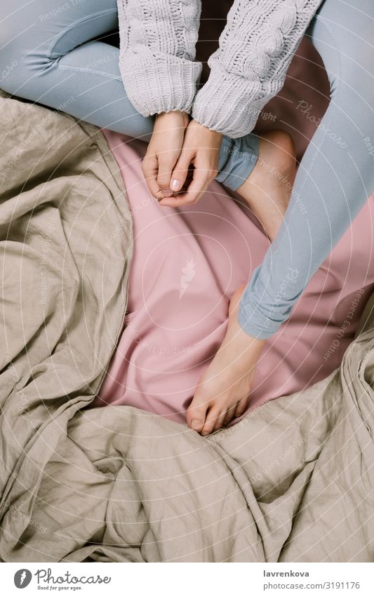 Cozy flatlay of woman's legs in blue leggins and sweater in bed Autumn Bedroom Blanket Duvet Clothing Cold Safety (feeling of) Faceless Fashion Woman flat lay
