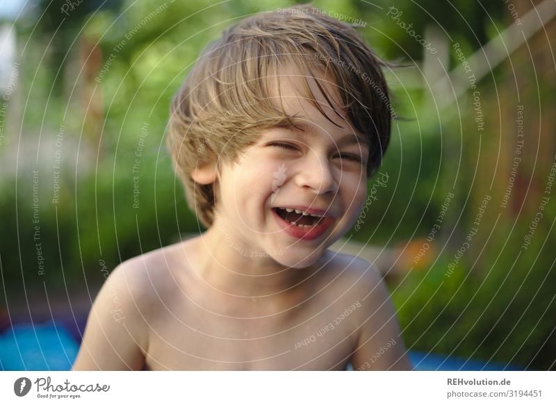 Kid laughs his head off Child bollocks Garden Summer naturally Naked Playing Infancy Front view Looking into the camera Face portrait Happy fortunate