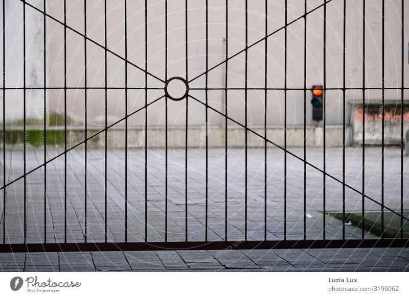 Iron gate, red traffic light Deserted Industrial plant Factory Gate Wall (barrier) Wall (building) Traffic light Concrete Steel Gray Red Closed Colour photo