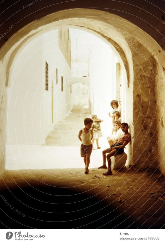 Friendship | Places of childhood children Goal Playing Sit Wall (barrier) Alley Shadow group Group of children daylight Wait Manmade structures Village