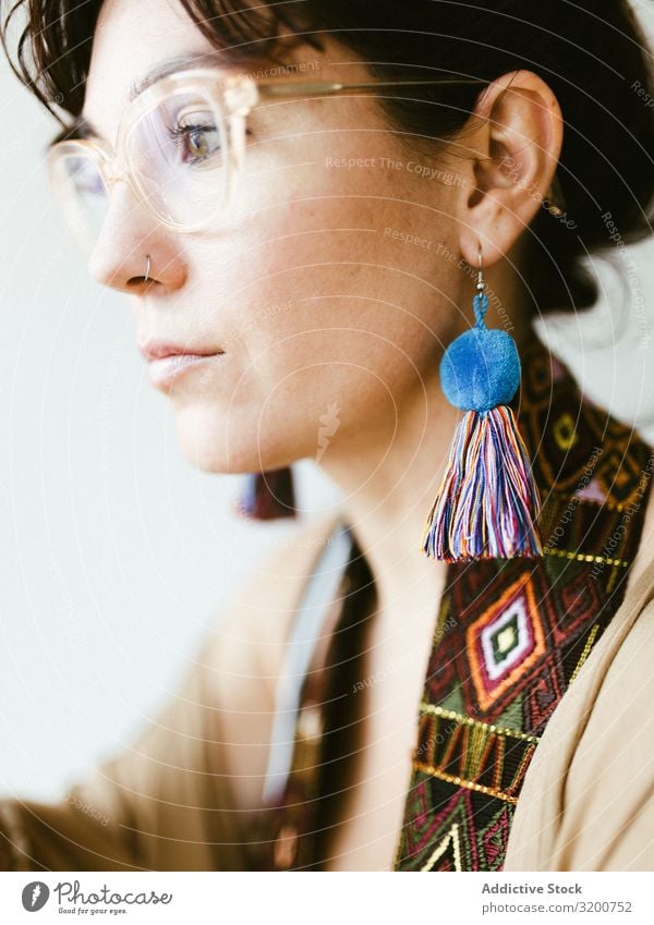 Portrait of beautiful woman with handmade earring Portrait photograph Woman Earring Self-made Beautiful Profile Dream Youth (Young adults) Brunette Thread