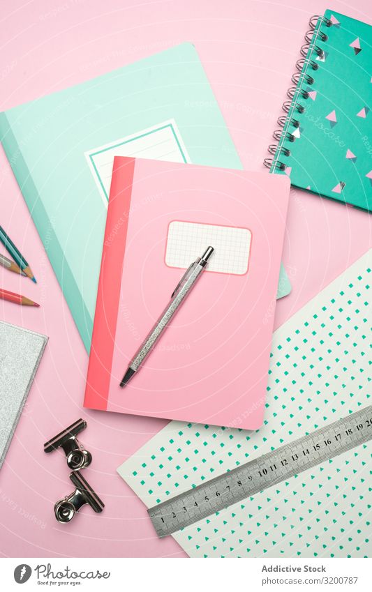 School stationery set on pink background Stationery Notebook Pen Ruler Pencil Office Accessory Paper Magazine Manual Equipment Supply Crayon Education