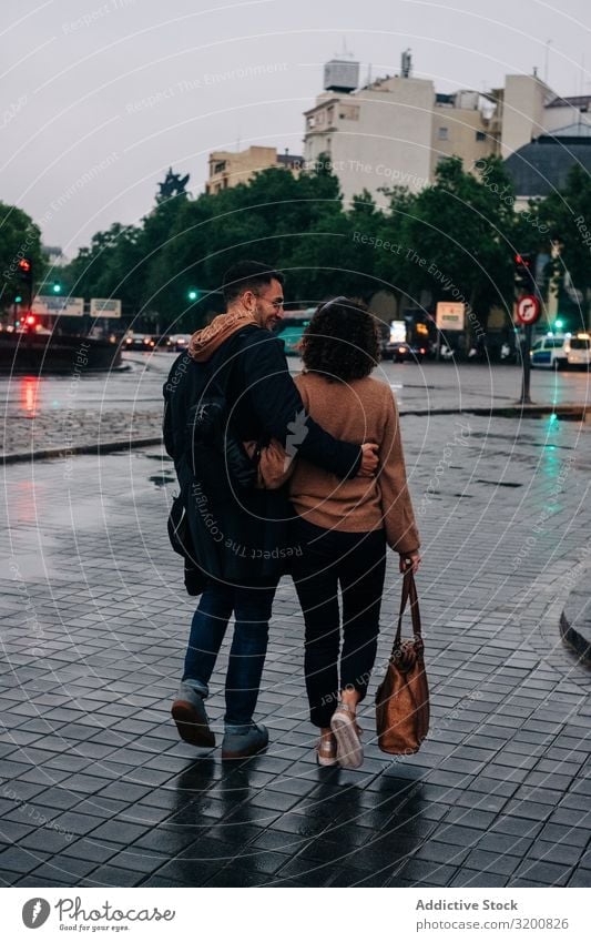 Young couple walking on wet street Couple Walking Street Wet Rain embracing Evening Pavement Together City Youth (Young adults) Man Woman Town Date Relationship