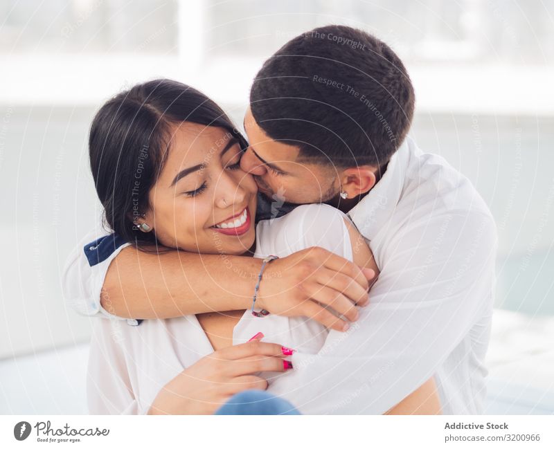 Man embracing smiling woman with love and tenderness Woman Embrace Passion Bonding Love Together Relationship Affectionate Happiness Youth (Young adults)