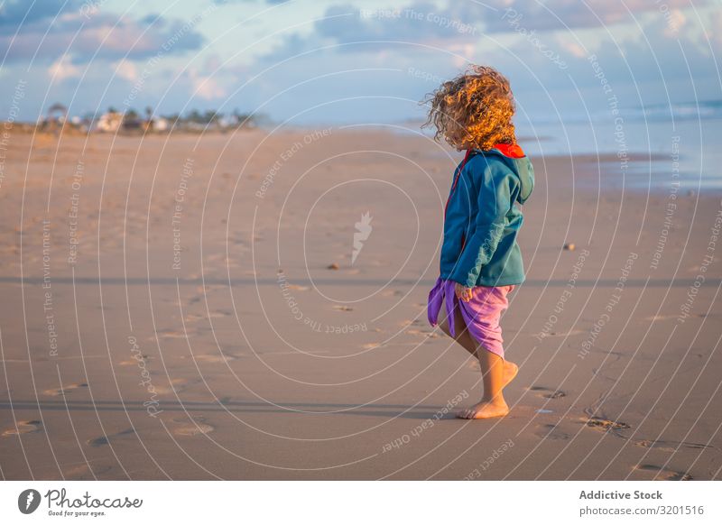 Little girl walking on seashore Girl Child Ocean Beach Summer Small Human being Curly hair Barefoot Beautiful Action Walking Vacation & Travel