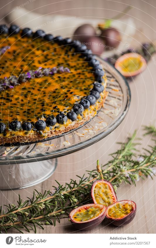 Tasty passion fruit pie decorated with blueberry Pie Blueberry Festive Natural Vegan diet Sesame Food Dessert Fresh Delicious Wood Home-made appetizing Baking
