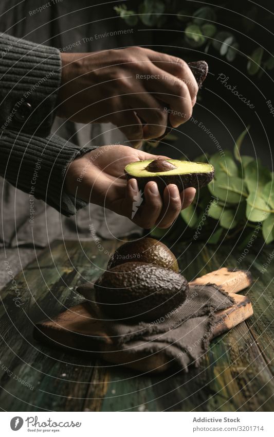 Person hands holding avocados Avocado Cut Diet Exotic Food Fresh Fruit Green Half Healthy Natural Nature Nutrition Organic Raw Mature Seed Tropical Vegan diet