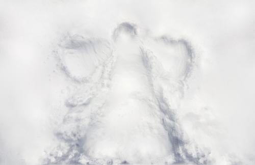 I child's snow angle imprint on fresh virgin snow on a winder holiday Wellness Life Leisure and hobbies Children's game Going out Feasts & Celebrations